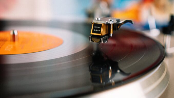 songs that break your heart - retro turntable playing vinyl disc in living room
