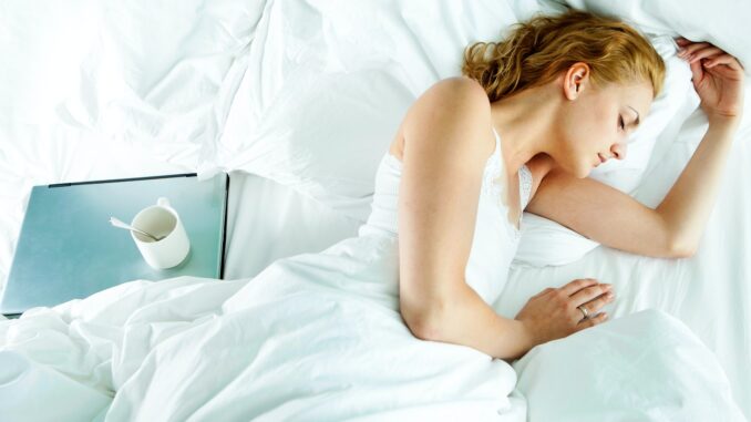 Woman asleep in her bed