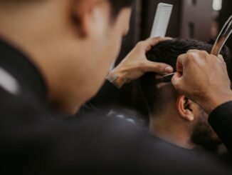 selective focus photography of a barber