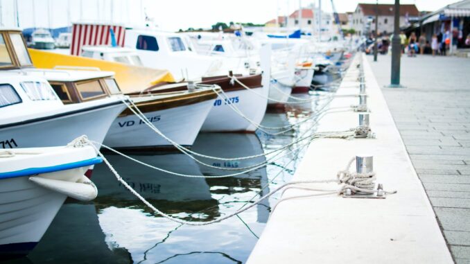 boats near dock - How You Can Fight Seasickness