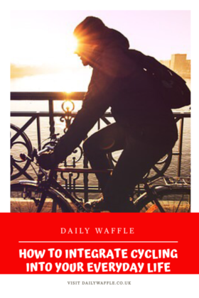 Man cycling, sunset in background