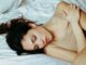 beautiful woman lying on bed