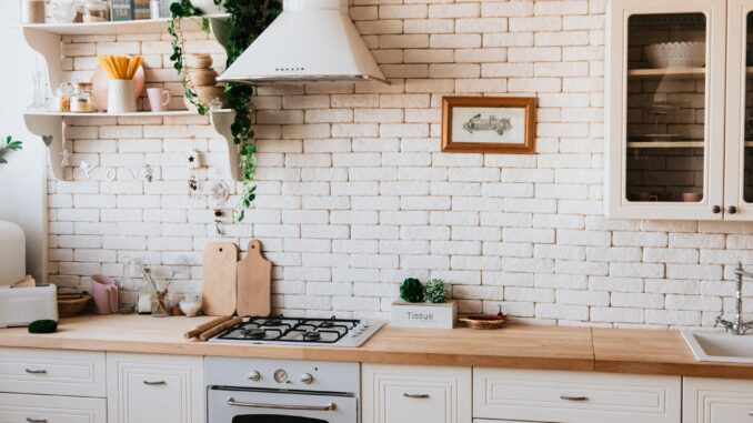 chopping boards near oven under hood - Top Five Interior Design Trends for 2021