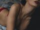 woman lying on bed - Who tops the global sexy search index?