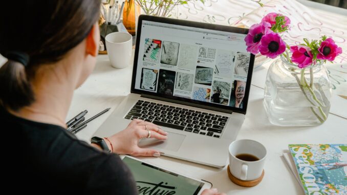 How to utilise your website to sell overseas photo of person using laptop for graphic designs