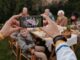 unrecognizable person taking photo of family dinner on smartphone - 8 Reasons to Store Family Photos on an External HD