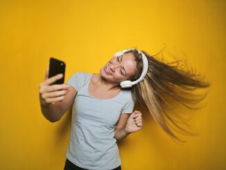 photography of a woman listening to music