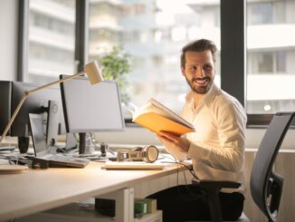 Our top tips to make distance learning more effective photo of man holding a book