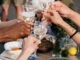 person holding clear wine glass