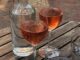 glasses of rose wine and water in outdoor restaurant