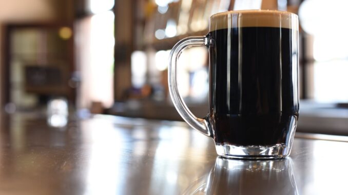 Data Reveals The UK's Best Independent Breweries - clear glass mug with black liquid