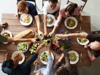 Average UK adult spends nearly £500 on subscription services a year - group of people making toast