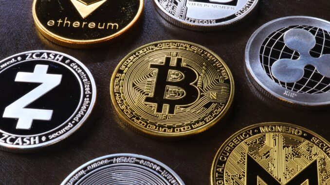 Is Bitcoin mining feasible for UK businesses? -various cryptocurrency on table