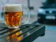 independent breweries - clear glass mug on black wooden table