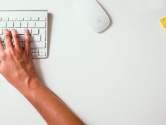 THESE Are The Most Satisfying Sounds According To TikTok - person holding apple keyboard