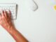 THESE Are The Most Satisfying Sounds According To TikTok - person holding apple keyboard