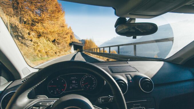 10 Most Distracting Christmas Driving Songs - vehicle on roadway near trees