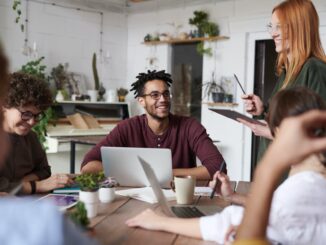 photo of people near laptops - 70% of SMEs believe their energy bill impacts the growth of their business