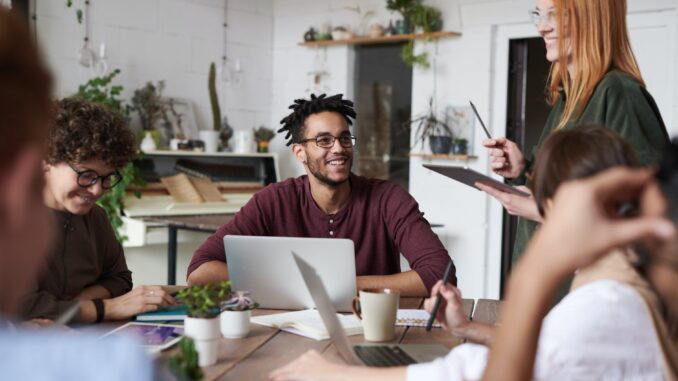 photo of people near laptops - 70% of SMEs believe their energy bill impacts the growth of their business