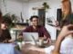 photo of people near laptops - 70% of SMEs believe their energy bill impacts the growth of their business