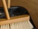 How Clean is Your Floor? - brown wooden brush on black plastic container