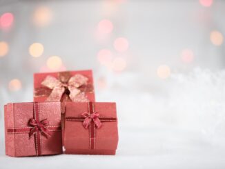 photo of red boxes - Grooming, Travel, & Experience Gifts are 'Most In-Demand' for Christmas 2021