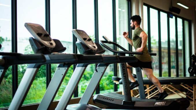 an on treadmill - 5 Fitness Trends To Watch Out For In 2022