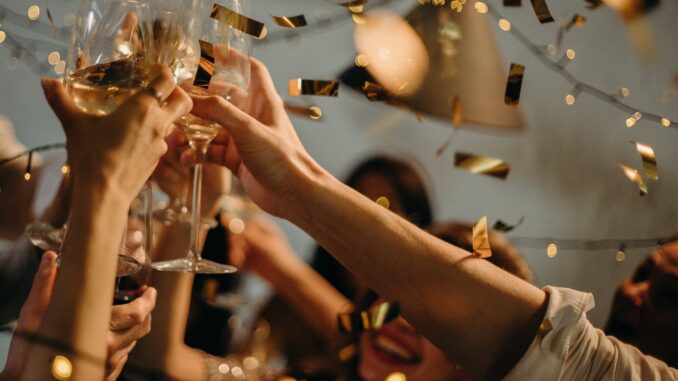 people toasting wine glasses - Christmas party
