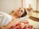 30 Wedding Beauty Trends Predictions for Winter 2021 and Spring 2022 - woman in wrapped in white towel lying on bed with eyes closed