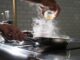 person pouring water on clear drinking glass - TikTok recipe takeover