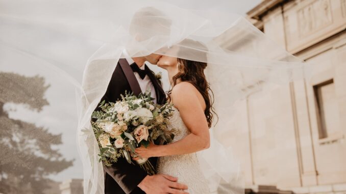 man and woman kissing
