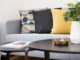 TikTok interior trends - centerpiece on coffee table beside sofa with three pillows