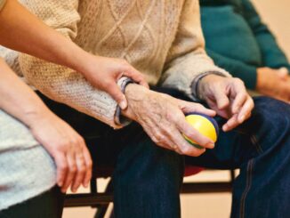 8 Ways Music Helps to Ease Dementia Symptoms -person holding a stress ball