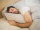 photo of sleeping man - men are getting more sleep