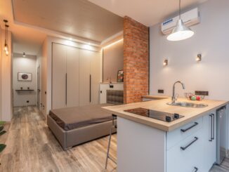 open plan kitchen - interior modern apartment with kitchen and bedroom