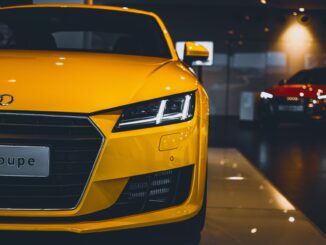 shiny yellow audi car in showroom