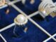 white pearl ring on blue surface