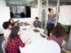 women colleagues gathered inside conference room