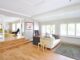 white couch near black mat