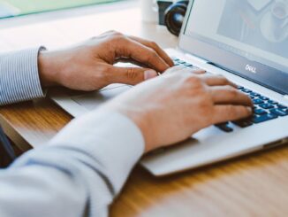 man using dell laptop