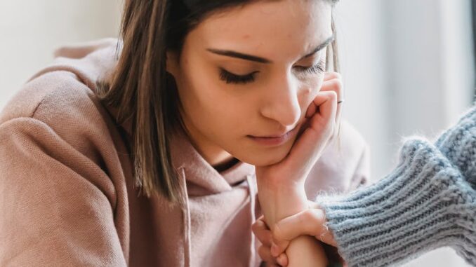 sad woman with anonymous female